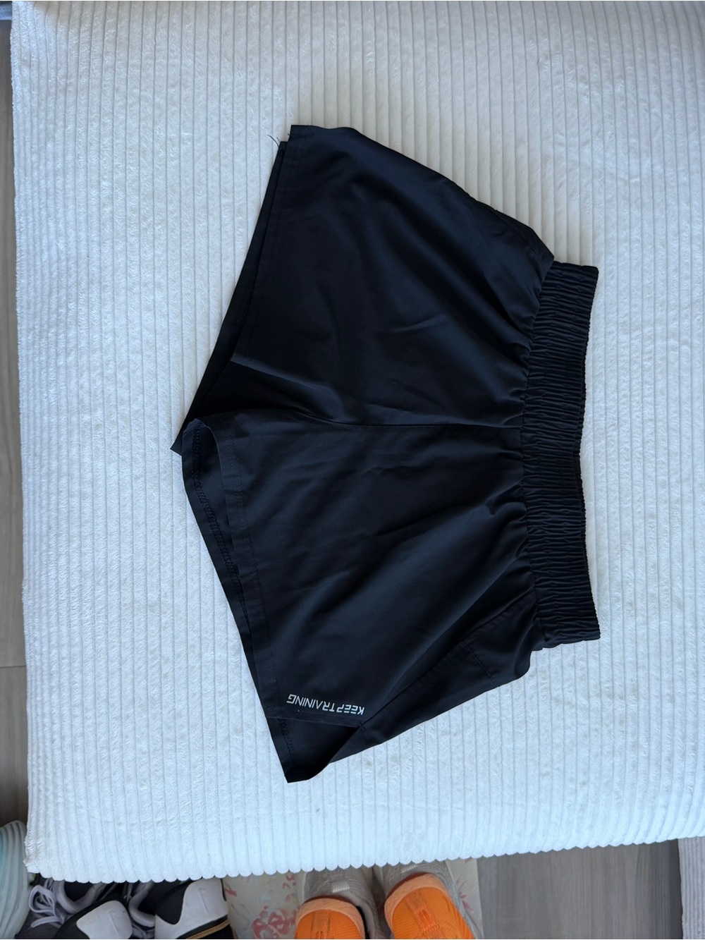 Black Athletic Running Shorts with 'KEEP TRAINING' Print